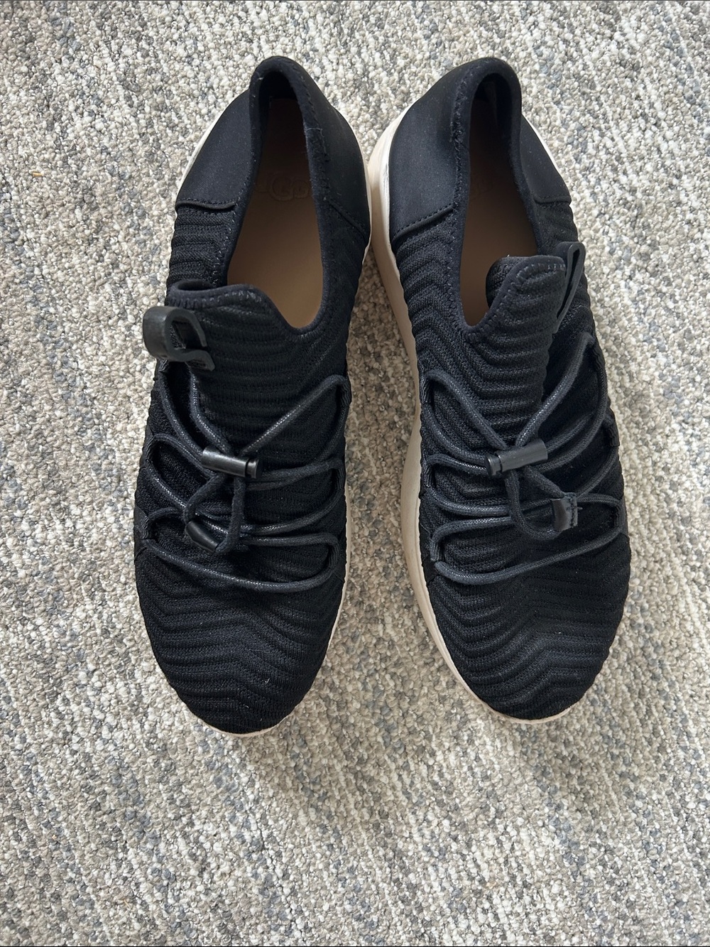 Uggs black slip on sneakers